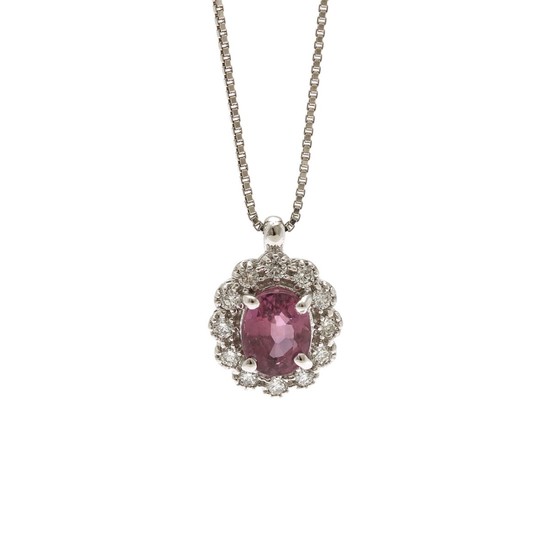 A ruby and diamond pendant set with an oval-cut ruby encircled by numerous brilliant-cut diamonds, mounted in 18k white gold and an 18k white gold necklace.