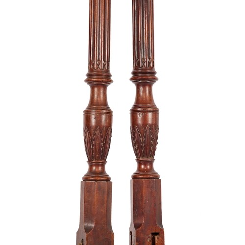 A set of George III mahogany carved bed posts With turned fl...