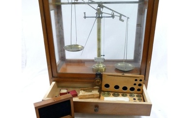 A set of early 20th century brass apothecary/precision scale...
