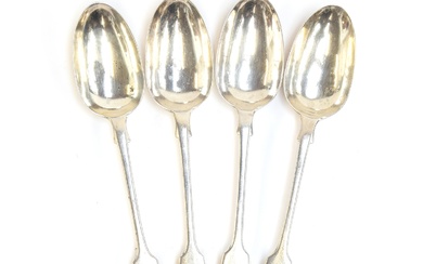 A set of four Victorian silver fiddle pattern table spoons b...