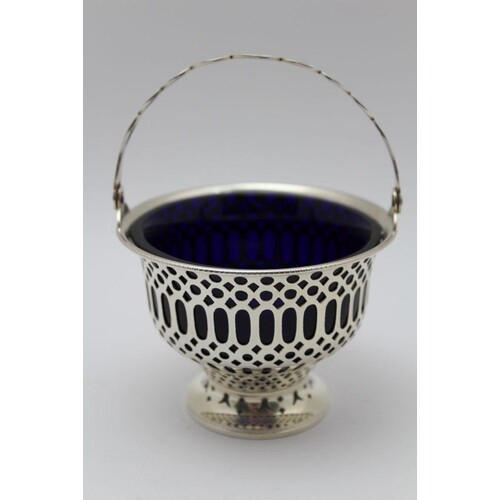 A silver bon-bon basket of Georgian design, pierced decorati...