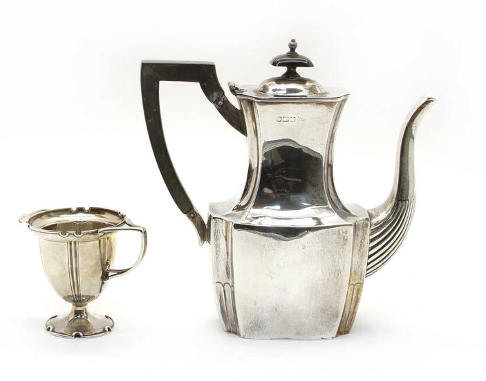 A silver hot water pot