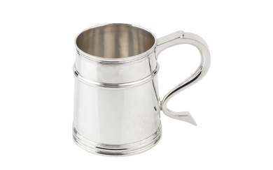 A silver pint mug, the tapered girdled body with reeded...