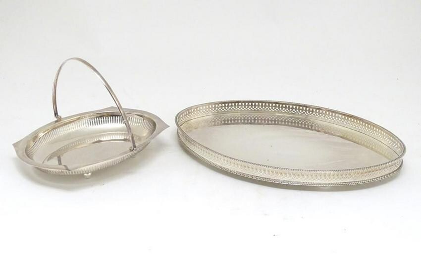 A silver plated oval tray with galleried side together