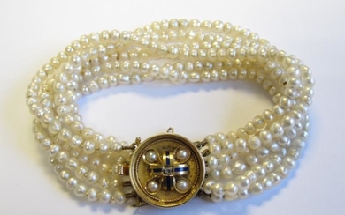 A six row Seed Pearl Bracelet on a circular...