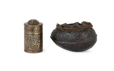 A small Qajar coco-de-mer begging bowl (kashkul) and an engraved brass inkwell...