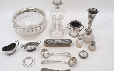 A small group of silver and silver plate, comprising: a silver plated twin handled pot, an Irish ladle with shell bowl, 20.3cm long; a silver mounted hand brush inscribed 'Blanche', Chester, 1897; a silver handled page turner, marks rubbed; a small...