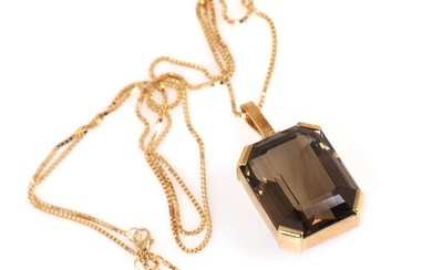 A smoky quartz pendant set with an emerald-cut smoky quartz, mounted in...