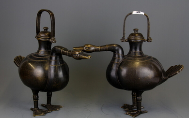 A superb pair of Chinese bronze goose shaped wine ewers, H. 34cm L. 39cm.