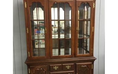 A vintage, large display cabinet. Sideboard-style base, with...