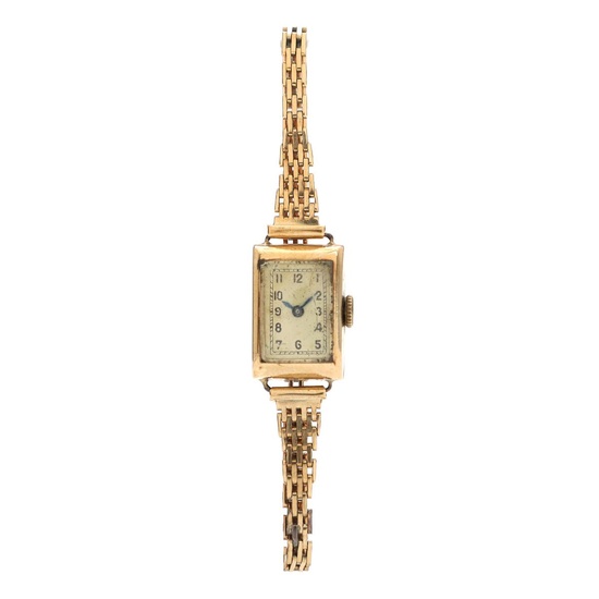 A wristwatch of 14k gold. Mechanical movement with manual winding. 14k gold...