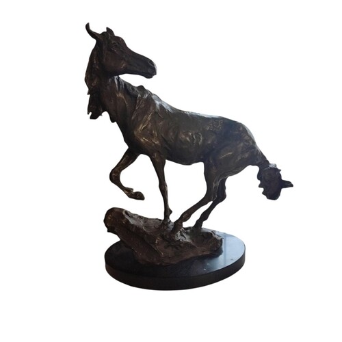AN ABSTRACT BRONZE HORSE SCULPTURE With one foot raised and ...