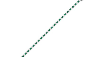 AN EMERALD AND DIAMOND LINE BRACELET comprising a row of alternating round cut emeralds and round