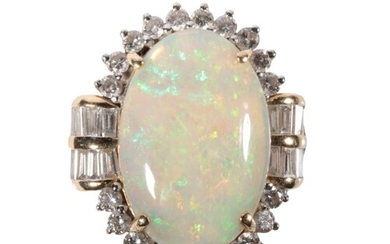 AN OPAL AND DIAMOND RING the large oval cabochon opal with g...