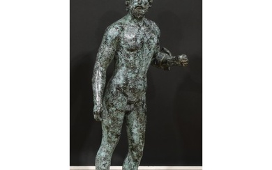 After the antique, a large verdigris patinated bronze figure...