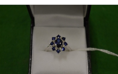 An 18ct white gold, diamond and sapphire cluster ring, size ...