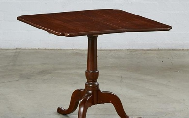 An American walnut tilt top tripod table
