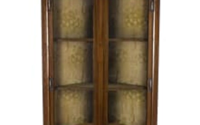 An Arts and Crafts mahogany and inlaid corner cabinet