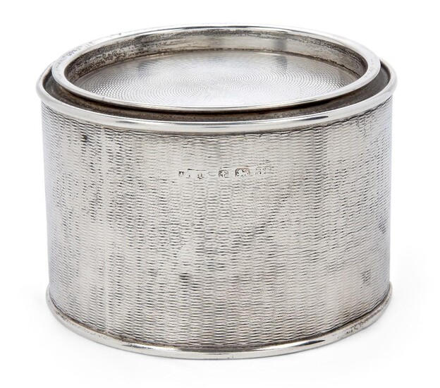 An Asprey & Co. novelty silver 'paint tin' tea caddy, Birmingham, 1933, of cylindrical form, designed with engine-turned lid and sides, 7.5cm high, 10.9cm dia., approx. weight 8.6oz