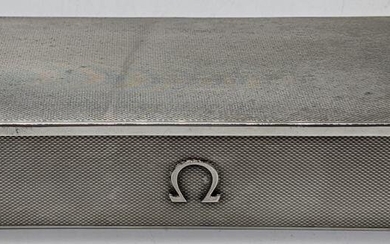 An Omega silver watch box, engine turned finish