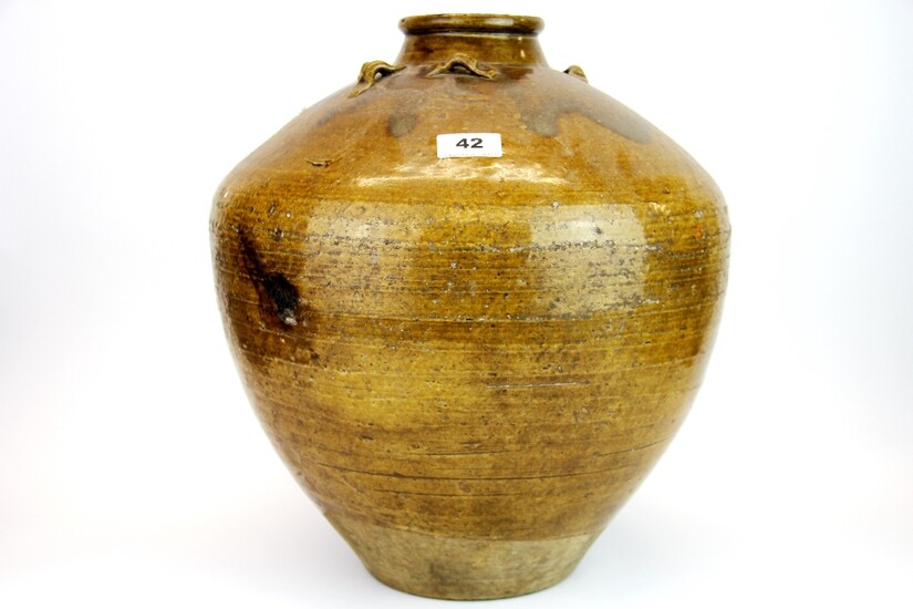 An early Chinese/ East Asian glazed pottery storage jar, H. 39cm.