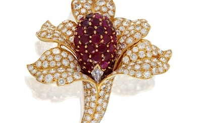 An eighteen karat gold, ruby, and diamond brooch designed...
