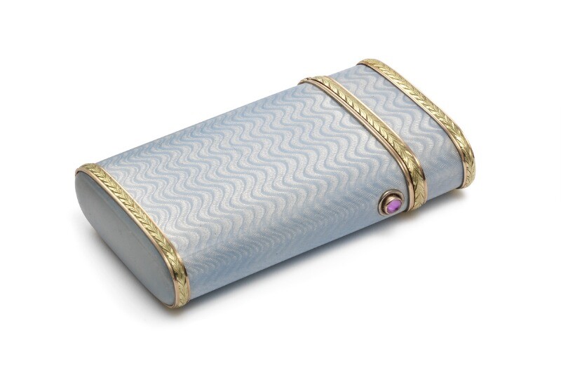 Andrei Karlovich Adler: A Russian two-colour gold and silver cigarette case with translucent blue enamel on guilloched ground. H. 10 cm. W. 5.5 cm.