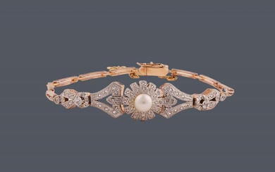 Bracelet ancien en or jaune 18 k sur cadran de platine orné d'une perle de...