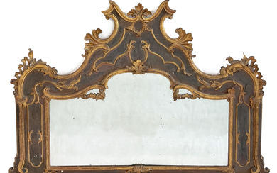 Caminiera in legno intagliato, dorato e dipinto di forma sagomata con cimasa a volute contrapposte. Lombardia, secolo XVIII (cm 111x165)…