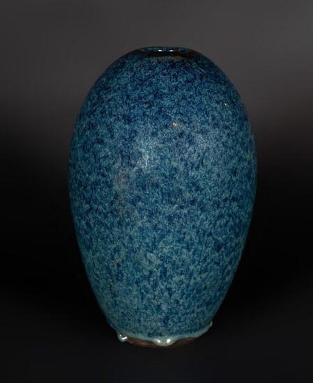 Chinese Art. A ""robin egg"" pottery oval vase bearing a four character mark engraved at the base China, Qing dynasty, 19th century . The elongated heavily potted black-paste body covered with a thick blue "robin egg" glaze . Cm 18,00 x 27,00.