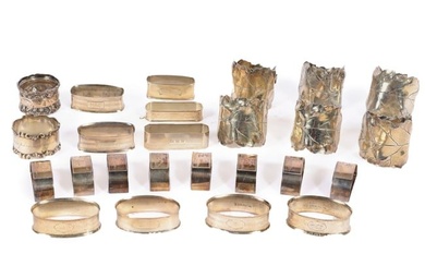 Collection of 25 sterling silver napkin holders: including a set of 8 demi-lune rings with engraved