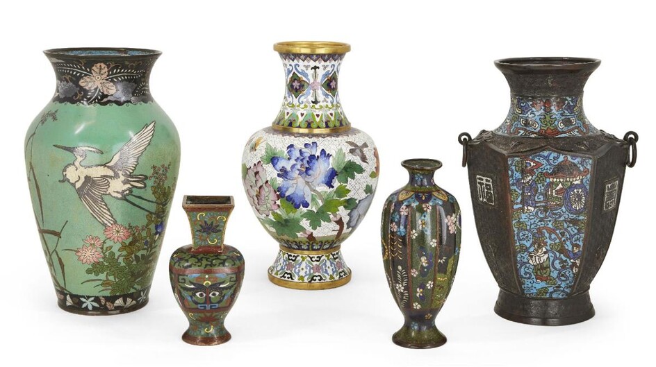 Five Japanese and Chinese cloisonné enamel vases, 19th century, to include a Japanese green enamel vase decorated with herons and iris, a Japanese white baluster vase of cherry blossom and peonies; together with three further Chinese cloisonné...