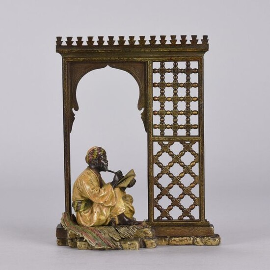 Franz Bergman (1861 ~ 1936) Cold painted Vienna bronze of an Arab man seated in a doorway. Signed with Bergman 'B', stamped Geschutz and numbered. Circa 1900 - Height 21cm.