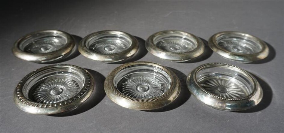 Group with Seven Sterling Silver Clad Molded Glass Coasters, D: 4 inches