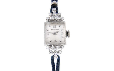 LONGINES - a lady's factory diamond set white metal cocktail wrist watch.