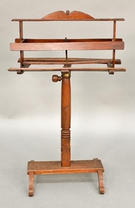 Mahogany double book stand on adjustable base, set on