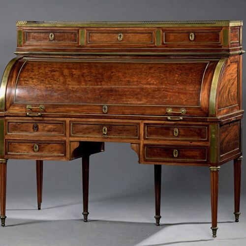 Mahogany speckled mahogany cylinder desk (all sides), opening with seven...
