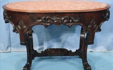 Oval rosewood rococo center table, attrib. to Meeks