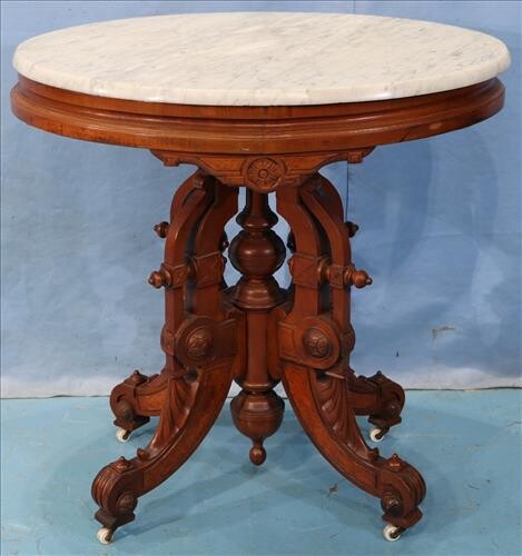 Oval walnut Victorian center table with marble