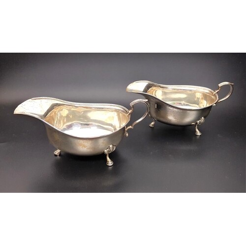 PAIR OF GEORGE V SILVER SAUCE BOATS both with beaded rims, s...