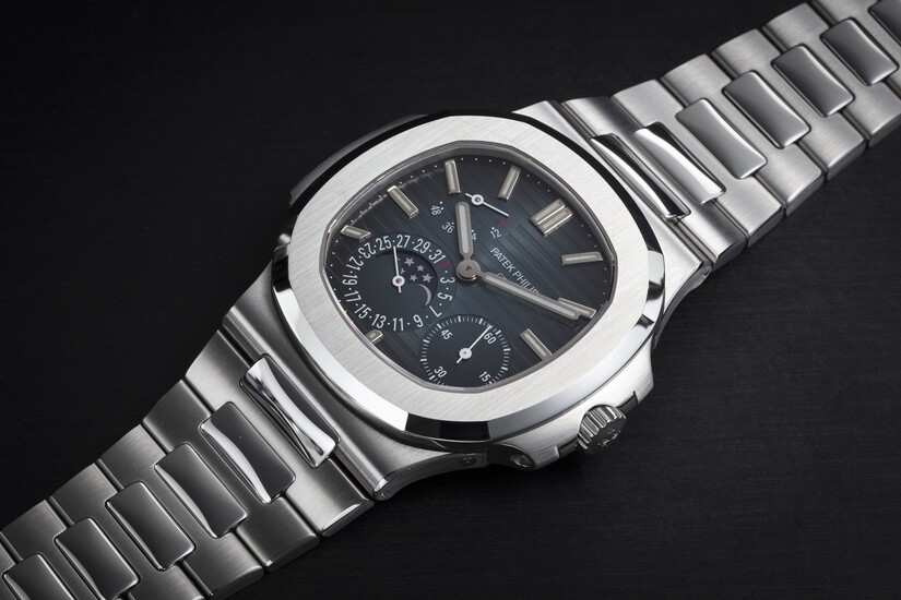 PATEK PHILIPPE, REF. 5712/1A-001, A STEEL AUTOMATIC WRISTWATCH WITH DATE, MOON-PHASE, AND POWER RESERVE