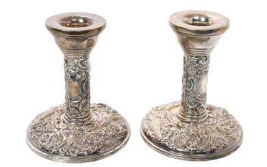 Pair contemporary silver candlesticks, with embossed flora and fauna decoration