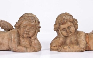 Pair of 18th Century limewood figures of reclining cherubs, both resting their heads on their hands