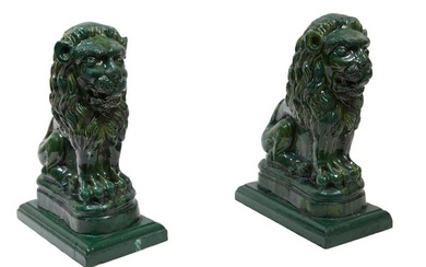 Pair of English Green Glazed Majolica Lion Figures, 20th c., H.- 17 in., W.- 7 1/2 in., D.- 12 1/4 i