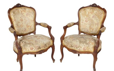 Pair of French Louis XV Style Carved Walnut Fauteuil, 19th c., pierced rocaille crest, padded shield