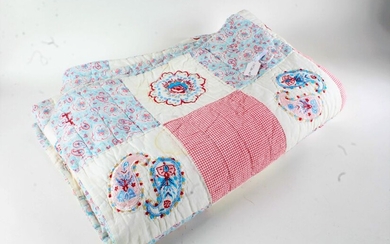 Paisley pattern patchwork quilt, in red, white and blue, with chequered patchwork to one side and