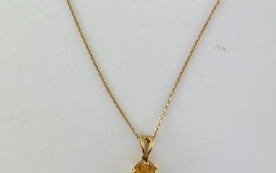 Pendant and its chain in 750°/°° gold set with a citrine cushion, Gross weight: 3g