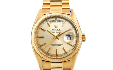 Rolex. A Yellow Gold Wristwatch with Day, Date and Bracelet