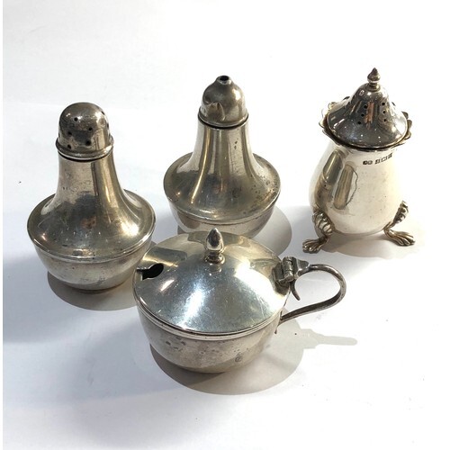 Selection of silver items includes salts pepper and mustard ...