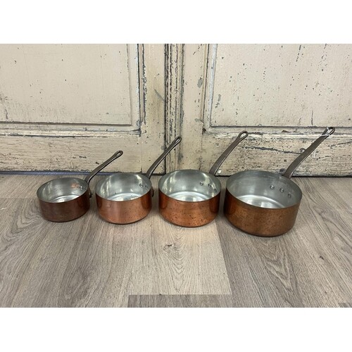 Set of four French copper and iron handled saucepans, stampe...